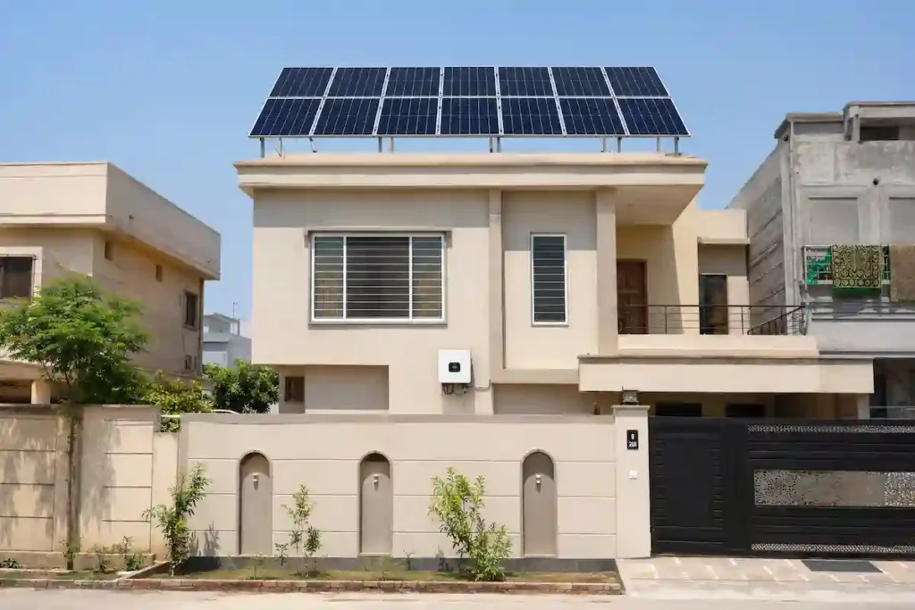 5kW solar system installed on a medium-sized Pakistani house with visible inverter