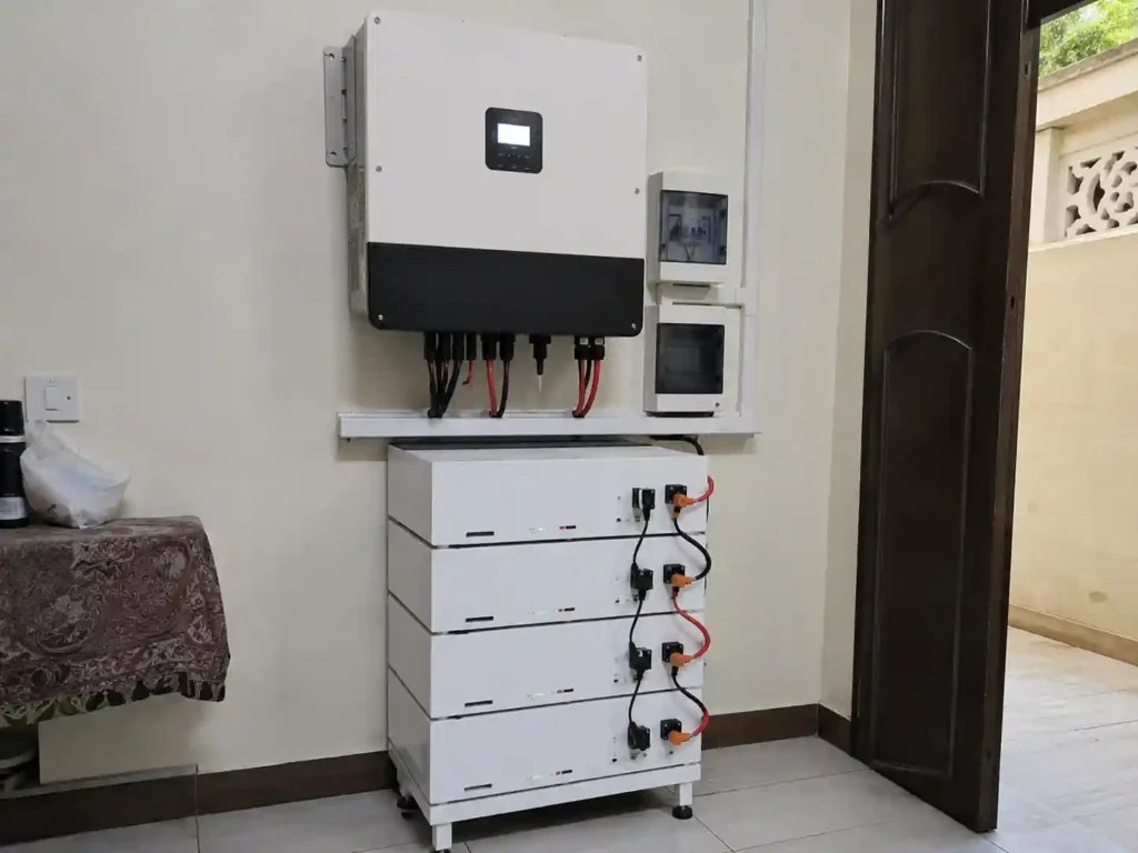 Hybrid solar inverter and battery bank installed in a home utility room in Pakistan
